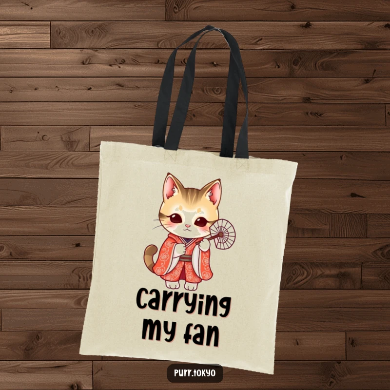 Funny tote bag featuring a cute cat in a vibrant red kimono holding a delicate fan, perfect for everyday chic.